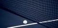 Tennis net and ball and hard court. Professional sport and tennis competition concept. Blue color filter Royalty Free Stock Photo