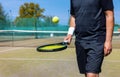 tennis player bounce the ball on racket at outdoor game court