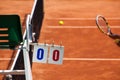 Tennis Player on a Clay Court with Umpire Chair Royalty Free Stock Photo