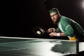 tennis player with frying pan with egg playing table tennis Royalty Free Stock Photo