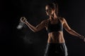 Tennis player girl with magnesium powder on her hands, grabbing a ball with dust visible Royalty Free Stock Photo