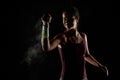 Tennis player girl with magnesium powder on her hands, grabbing a ball with dust visible Royalty Free Stock Photo