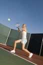 Tennis Player Hitting Backhand On Court