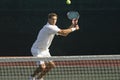 Tennis Player Hitting Backhand On Court Royalty Free Stock Photo