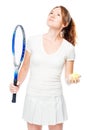 Tennis player holds a racket and ball for tennis and looks upwards on a white background