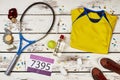 Tennis player`s uniform and racquet