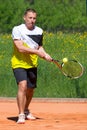 Tennis player on sand court Royalty Free Stock Photo