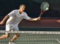 Tennis Player Swinging at Ball Royalty Free Stock Photo