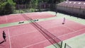 Tennis players during match on court in summer