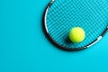 Tennis racket and ball on blue background, top view. Space for text Royalty Free Stock Photo
