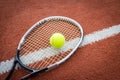 Tennis racket and ball on court Royalty Free Stock Photo