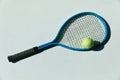 Tennis racket and ball on the floor Royalty Free Stock Photo