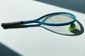 Tennis racket and ball on the floor Royalty Free Stock Photo
