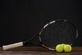 Closeup shot of tennis racket and three balls placed Royalty Free Stock Photo