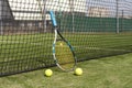 tennis racket with balls on green background. Royalty Free Stock Photo