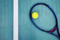 Tennis racket, line and a tennis ball on a concrete court Royalty Free Stock Photo