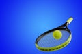 Tennis racket and sports ball on a blue background Royalty Free Stock Photo