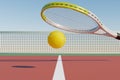 A tennis racket and a sports ball in flight against the backdrop of a court with a net. Royalty Free Stock Photo