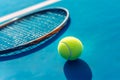 Tennis racket and ball under evening sunlight on tennis court. Tennis balls and racquet on blue court background. Generative AI Royalty Free Stock Photo