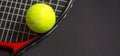 Tennis racket with tennis balls in green color, isolated on black background, lighting detail sport concept Royalty Free Stock Photo