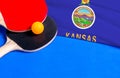 Tennis rackets and ball with flag Kansas on blue background, flag mockup. Table tennis competition concept