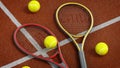 Tennis rackets and balls on hard court. 3D illustration Royalty Free Stock Photo