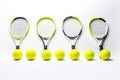 Tennis rackets and balls isolated on white background. Top view, Tennis balls on a rackets on different positions, white Royalty Free Stock Photo