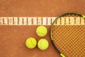 Tennis racquet tennis balls on clay court Royalty Free Stock Photo