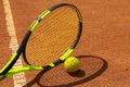 Tennis racquet and tennis ball clay court Royalty Free Stock Photo