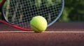 Tennis racquet and yellow tennis ball on outdoor court Royalty Free Stock Photo