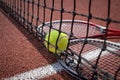 Tennis scene with black net, ball and racquets Royalty Free Stock Photo