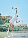 Tennis serve, sports and woman jump on outdoor court, fitness motivation and competition with athlete training for game Royalty Free Stock Photo