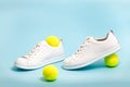 Tennis shoes on blue background Royalty Free Stock Photo