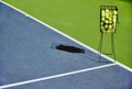 Tennis, sport balls and basket of sports equipment on a training court outdoor with no people. Exercise, fitness and Royalty Free Stock Photo