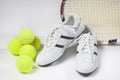 Tennis sports Concept: Raquet, Balls and Sneakers against white Royalty Free Stock Photo