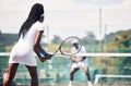 Tennis, team game and african couple workout competition, sports exercise or outdoor wellness. Tennis court, athlete Royalty Free Stock Photo