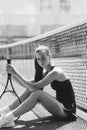 Beautiful girl athlete on the tennis court. Tennis training, racket and ball, concept. Royalty Free Stock Photo