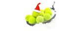 Tennis winter concept with tennis balls and racket on white snow, isolated. Top view, copy space. Royalty Free Stock Photo