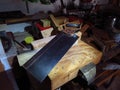 An old carpenter`s tenon saw lying in a workshop. Royalty Free Stock Photo