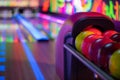 Tenpin balls with blurred alley in background