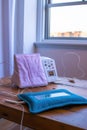 tens unit and a heating pad on a clinic table Royalty Free Stock Photo
