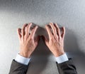 Tensed businessman hands expressing impatience, stress or self-controlled anger