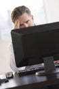 Tensed Businessman Looking At Computer Monitor