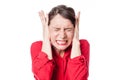 Tensed young woman covering ears to refuse listening to problems