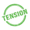 TENSION text written on green grungy round stamp