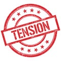 TENSION text written on red vintage stamp