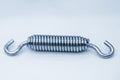 The tension wire coil spring in the light blue scene Royalty Free Stock Photo