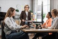 Tensive caucasian woman working using laptop with financial report office.