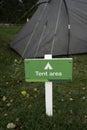 Tent area sign with blurred tent in background