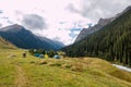 Tent basecamp in mountain river valley Royalty Free Stock Photo